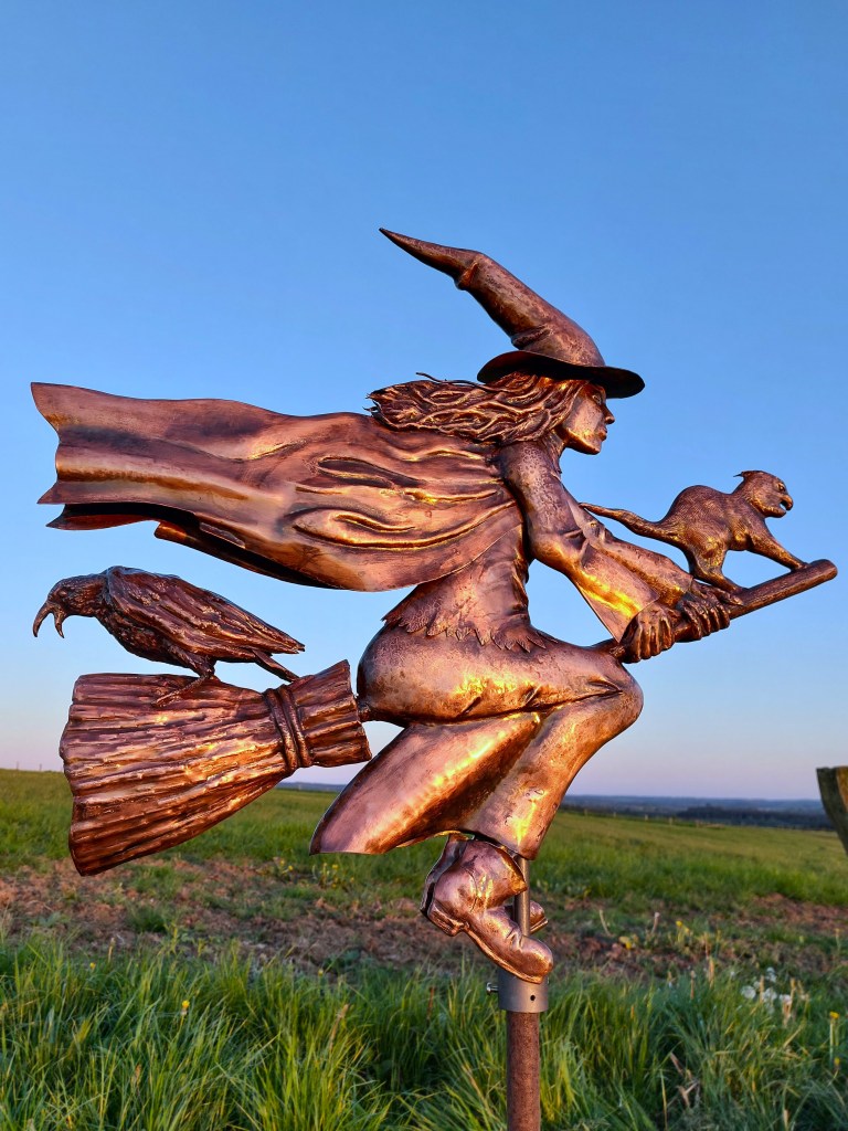 copper witch wind sculpture